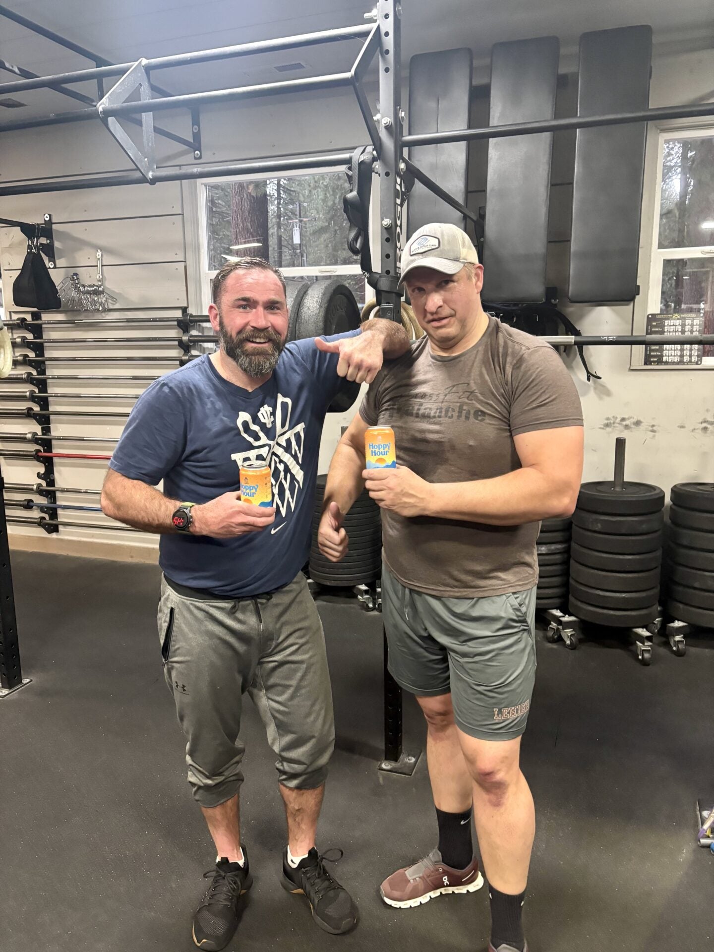 Two people holding Hoppy Hour after a workout